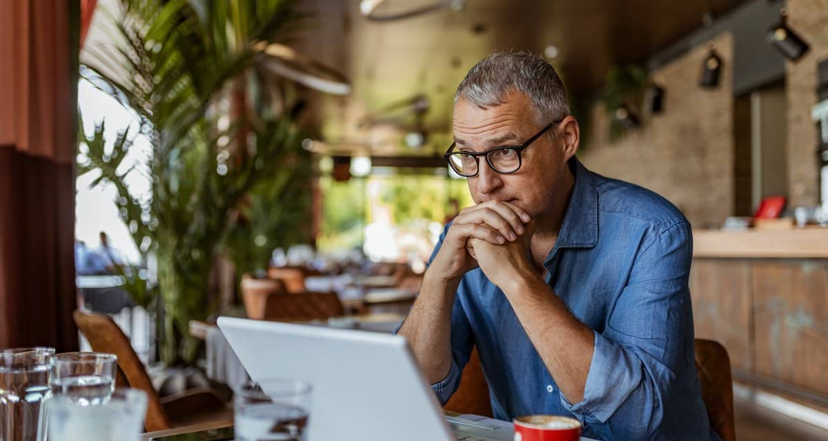 stressed man in cafe QYWidk.width .jpg