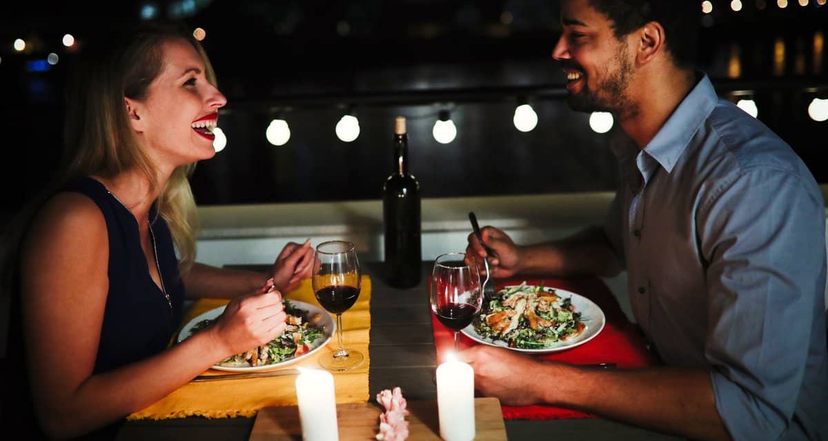 young man and woman sitting at table eating d.width YXBhB.jpg