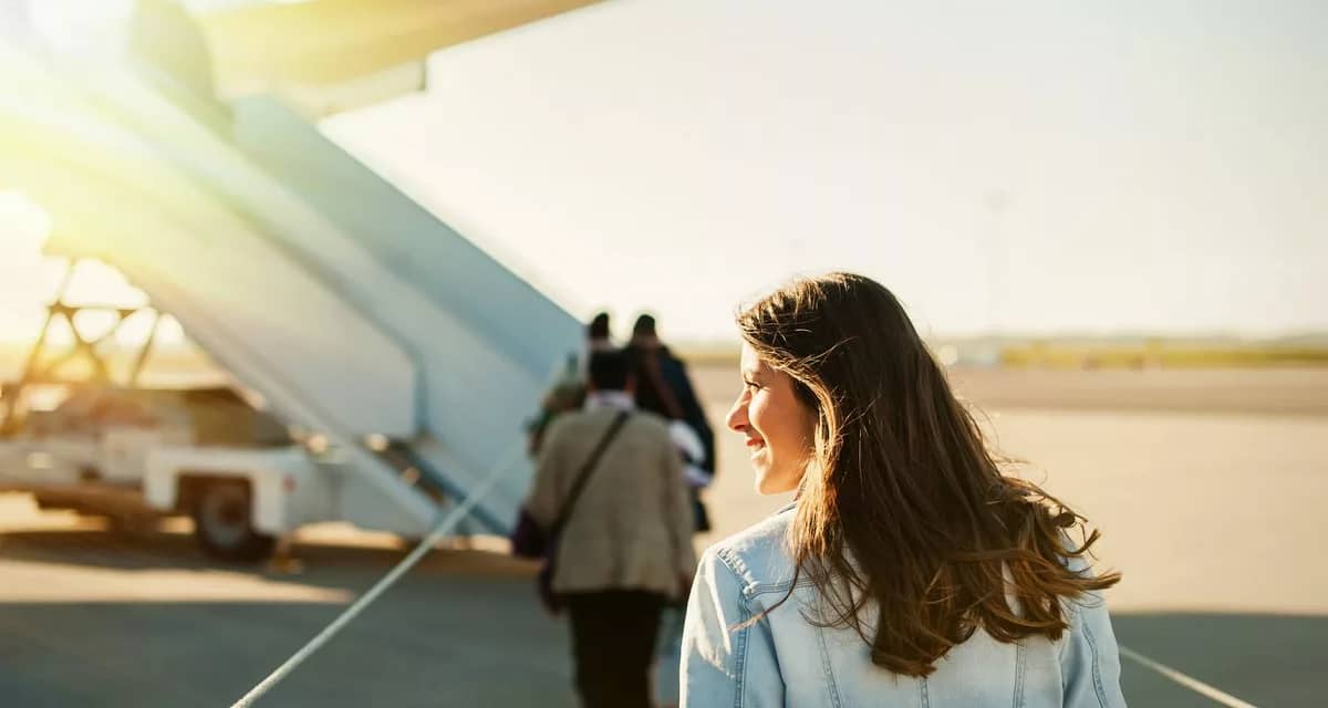 woman boarding plane outside.width .jpg