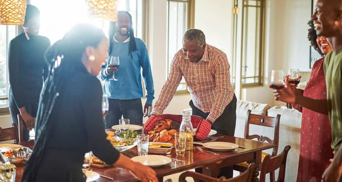 family at Thanksgiving table jIYUm.width .jpg