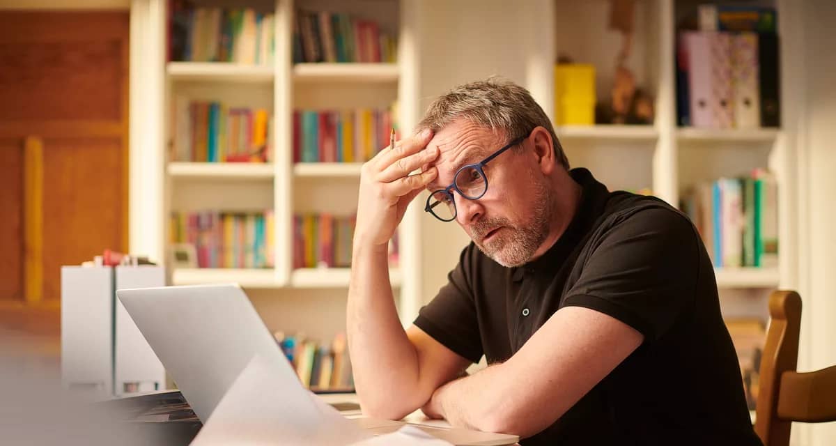 overwhelmed person looking at laptop.jpg