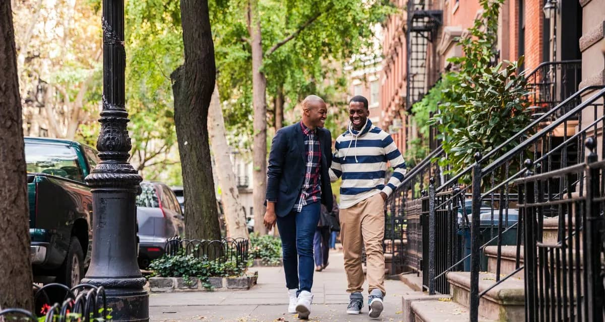 two men walking down street.width .jpg