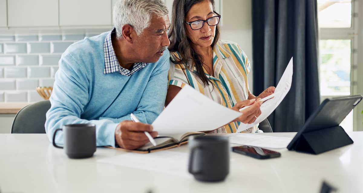 couple looking at documents together in kitchen.jpg