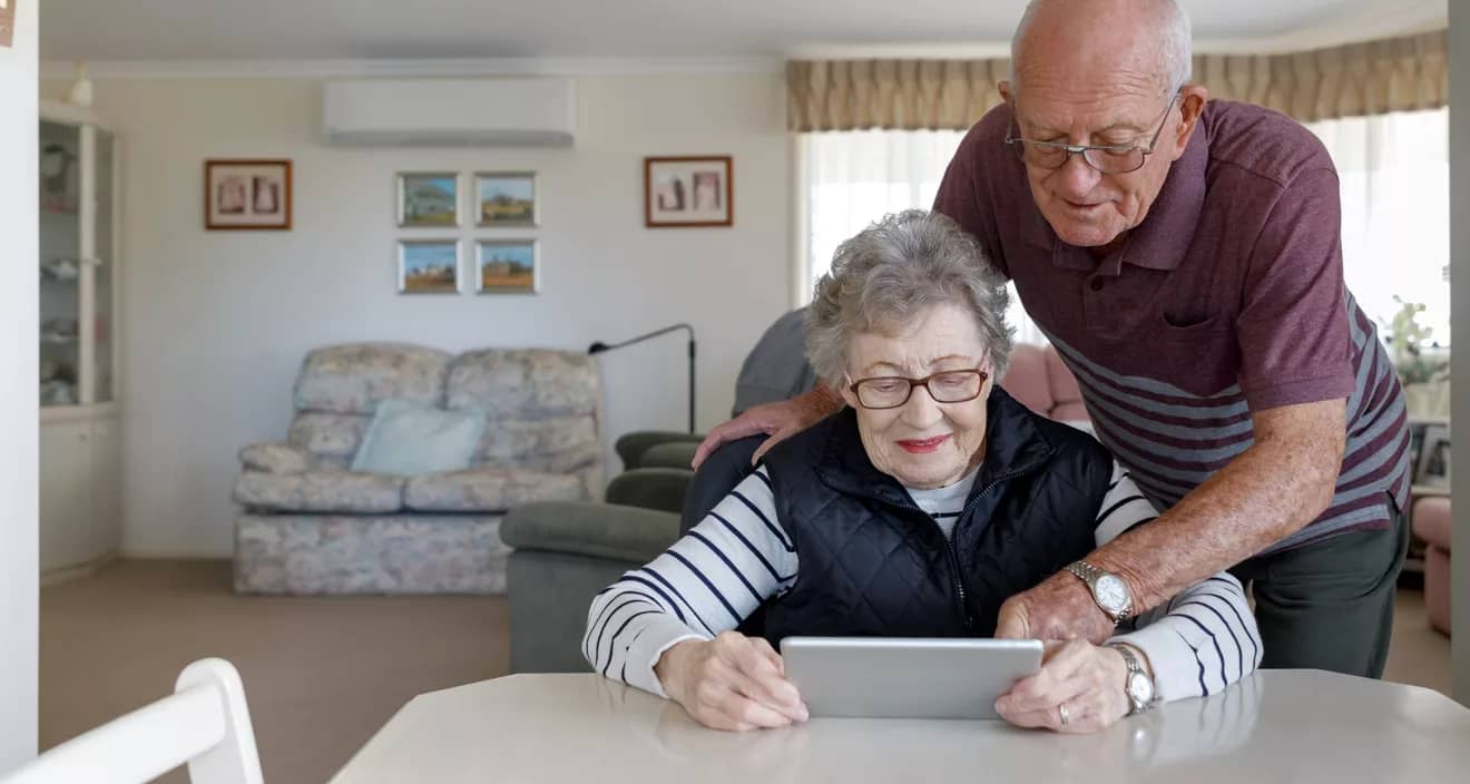 couple looking at tablet together.jpg