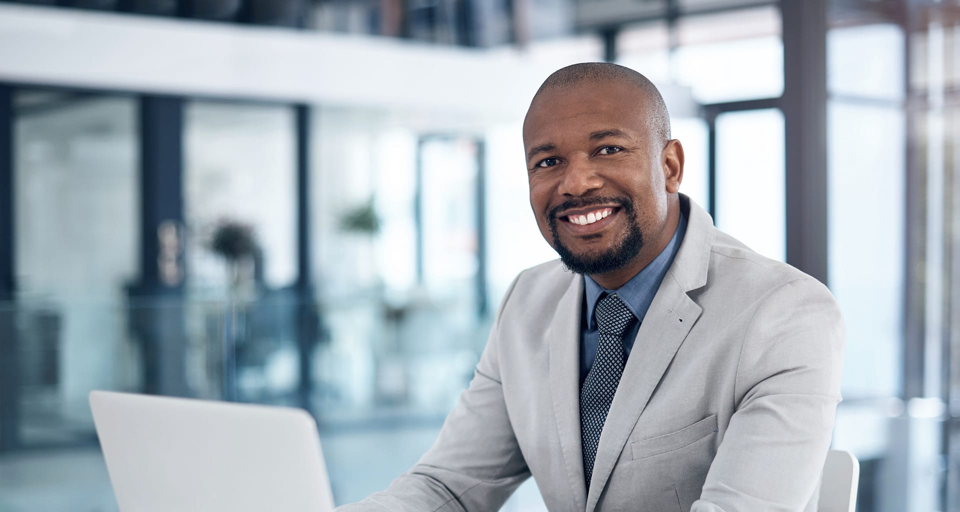 man s business suit laptop gettyimages xRtoVl