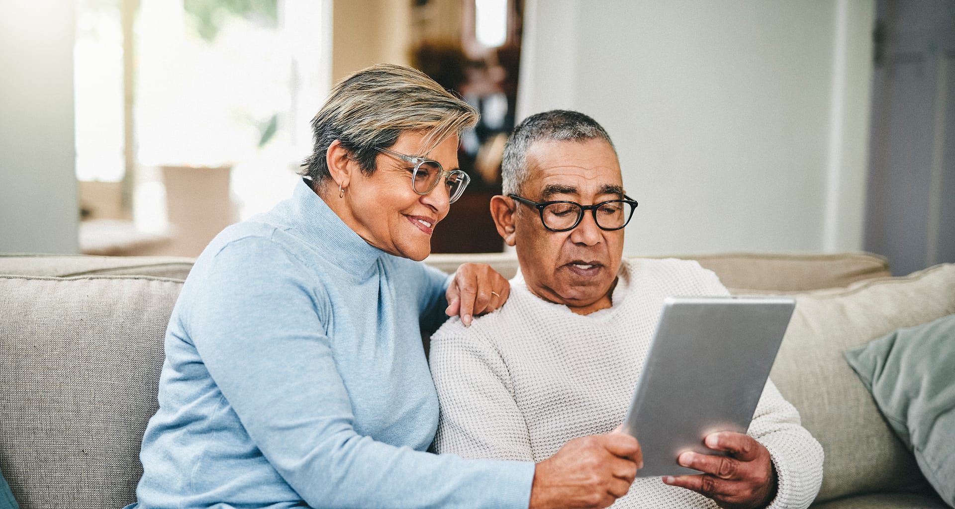senior couple using a digital tablet at home
