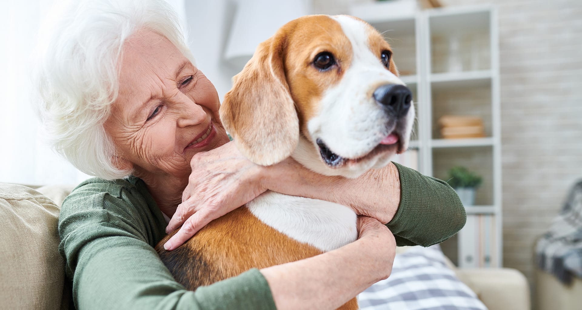 happy granny loving her dog in retirement