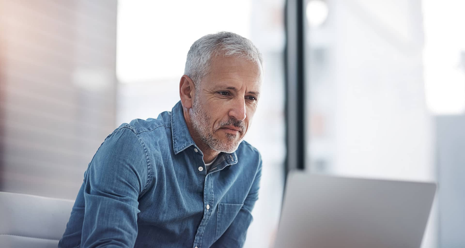 older man at laptop gettyimages