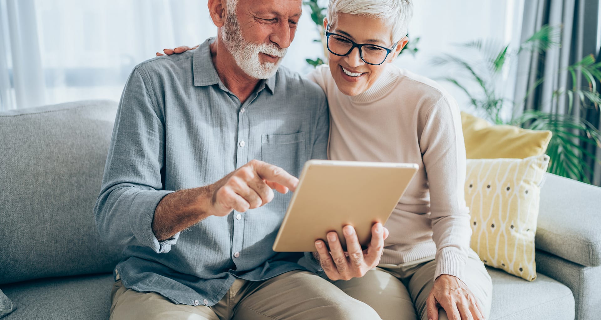 senior couple looking at tablet gettyimages