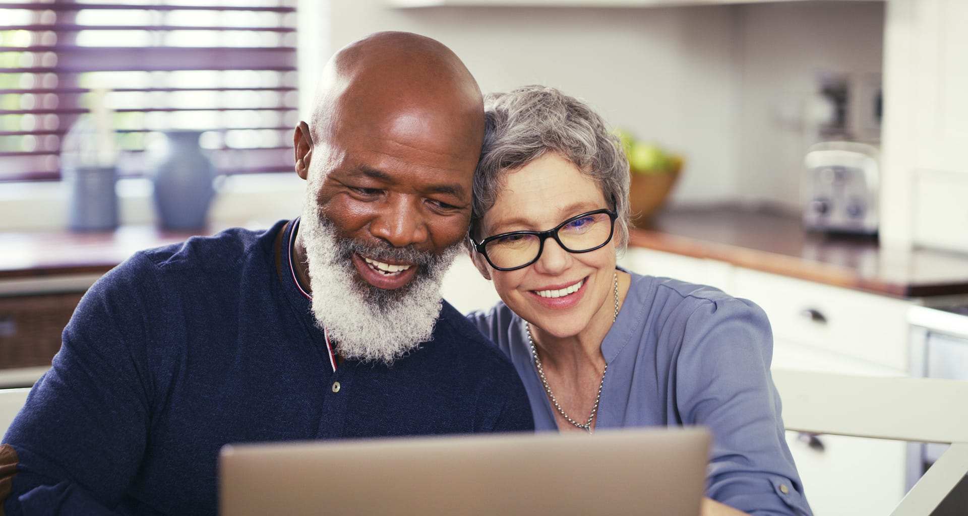 older couple at laptop smiling gettyimages .jpg