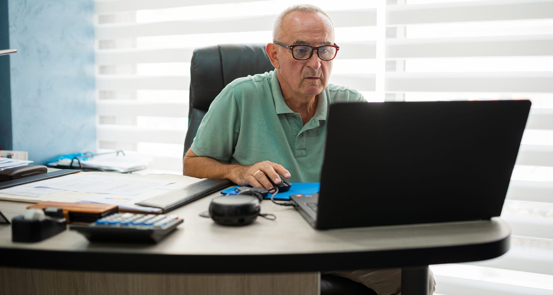 older man desk serious gettyimages .jpg