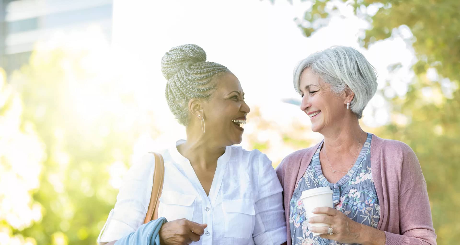 two older people walking outside smiling.jpg