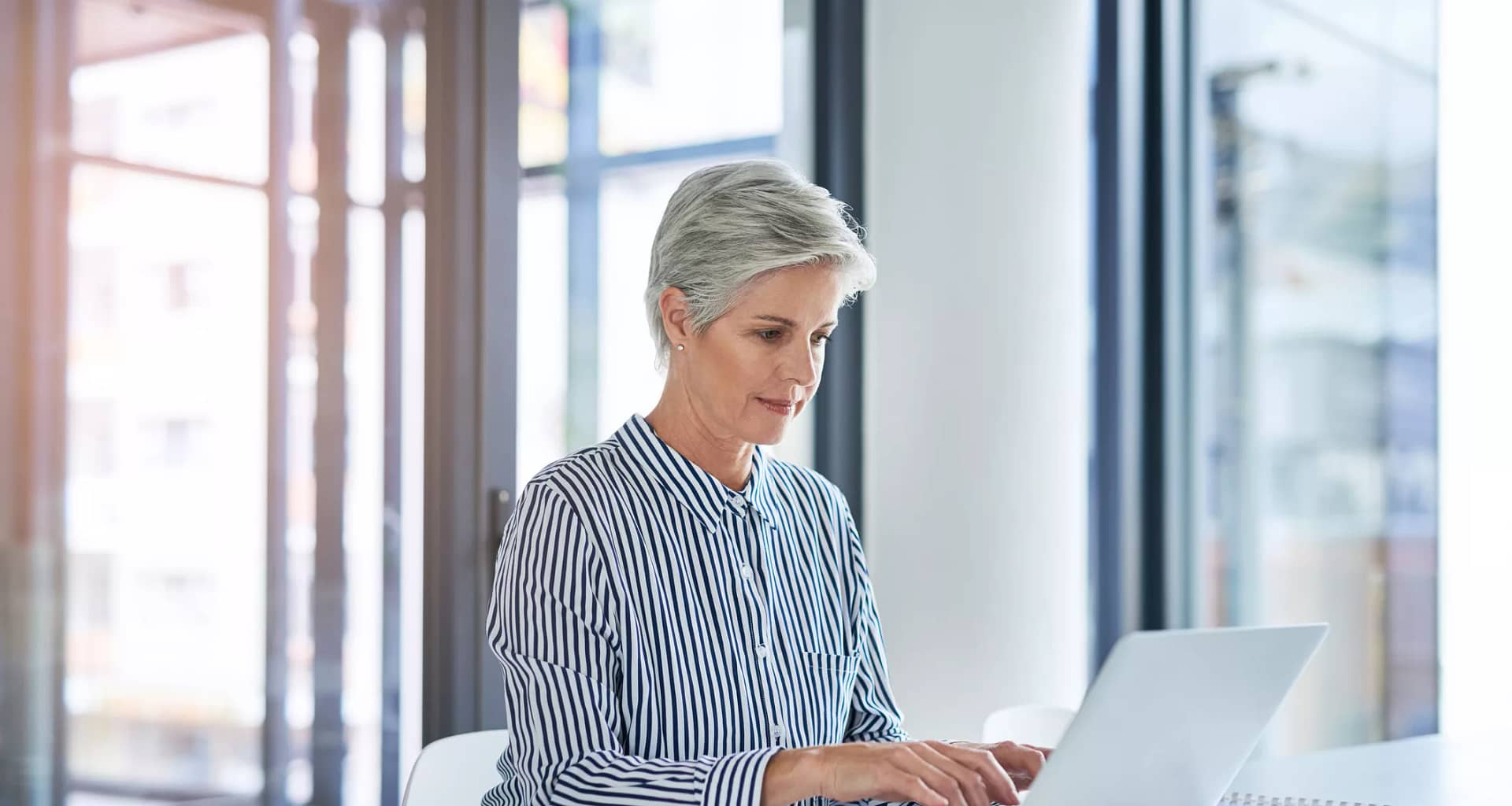 woman older laptop gettyimages .jpg