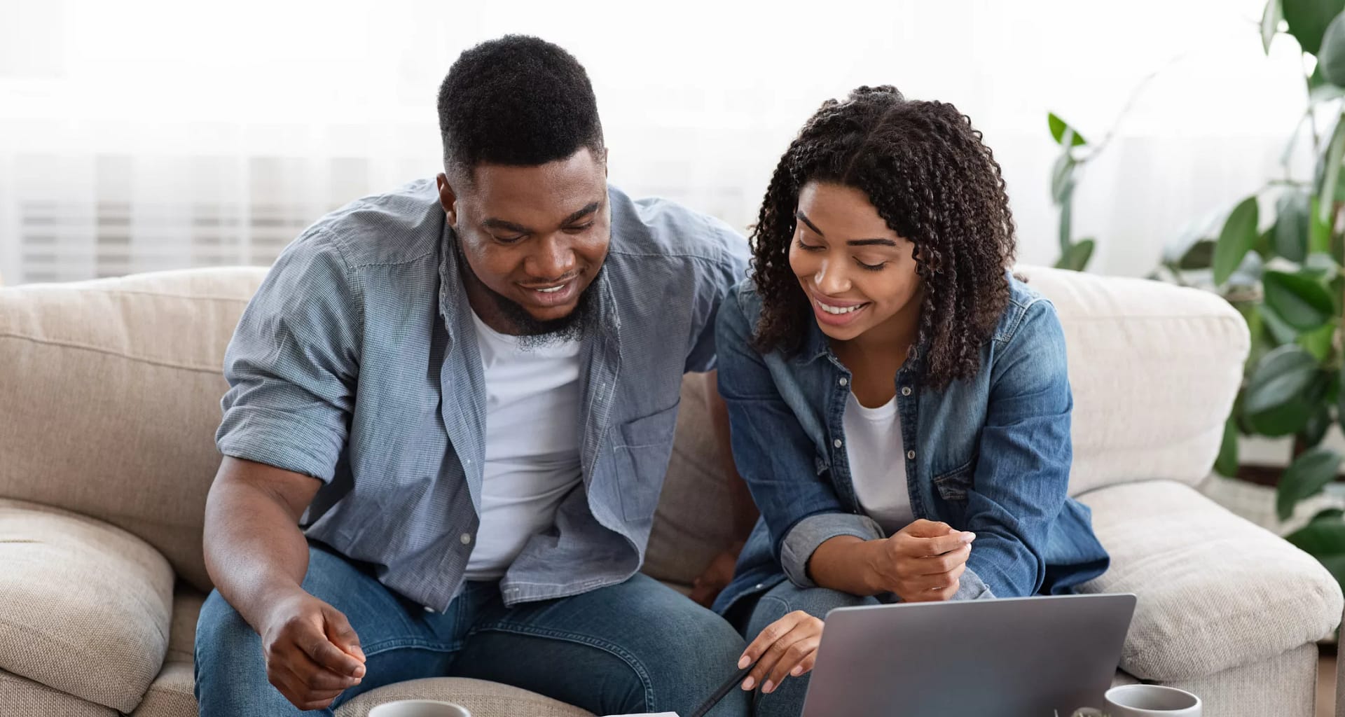 smiling couple looking at documents.jpg