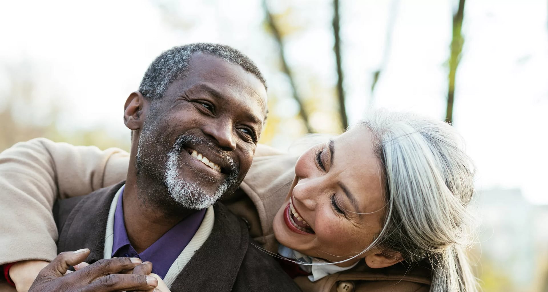 two older people hugging and smiling.jpg
