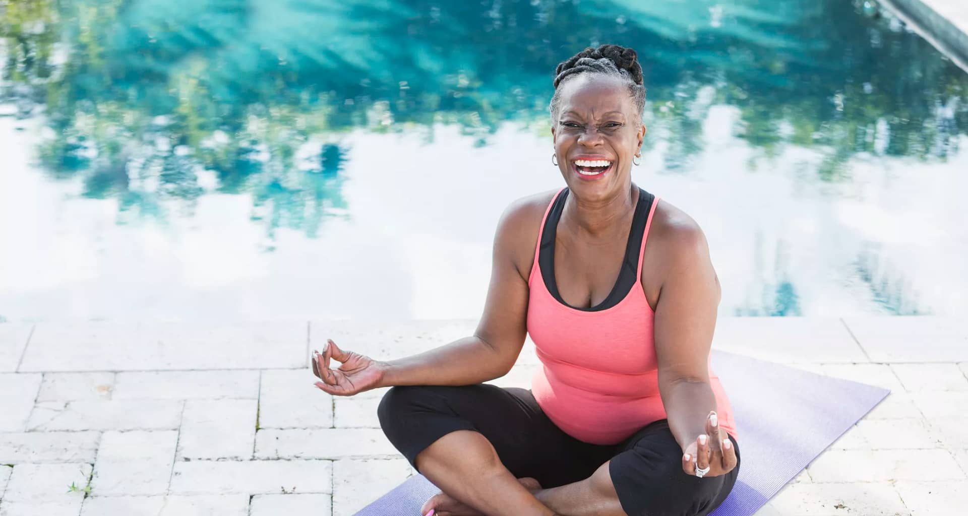 getty smiling happy meditating yoga.jpg