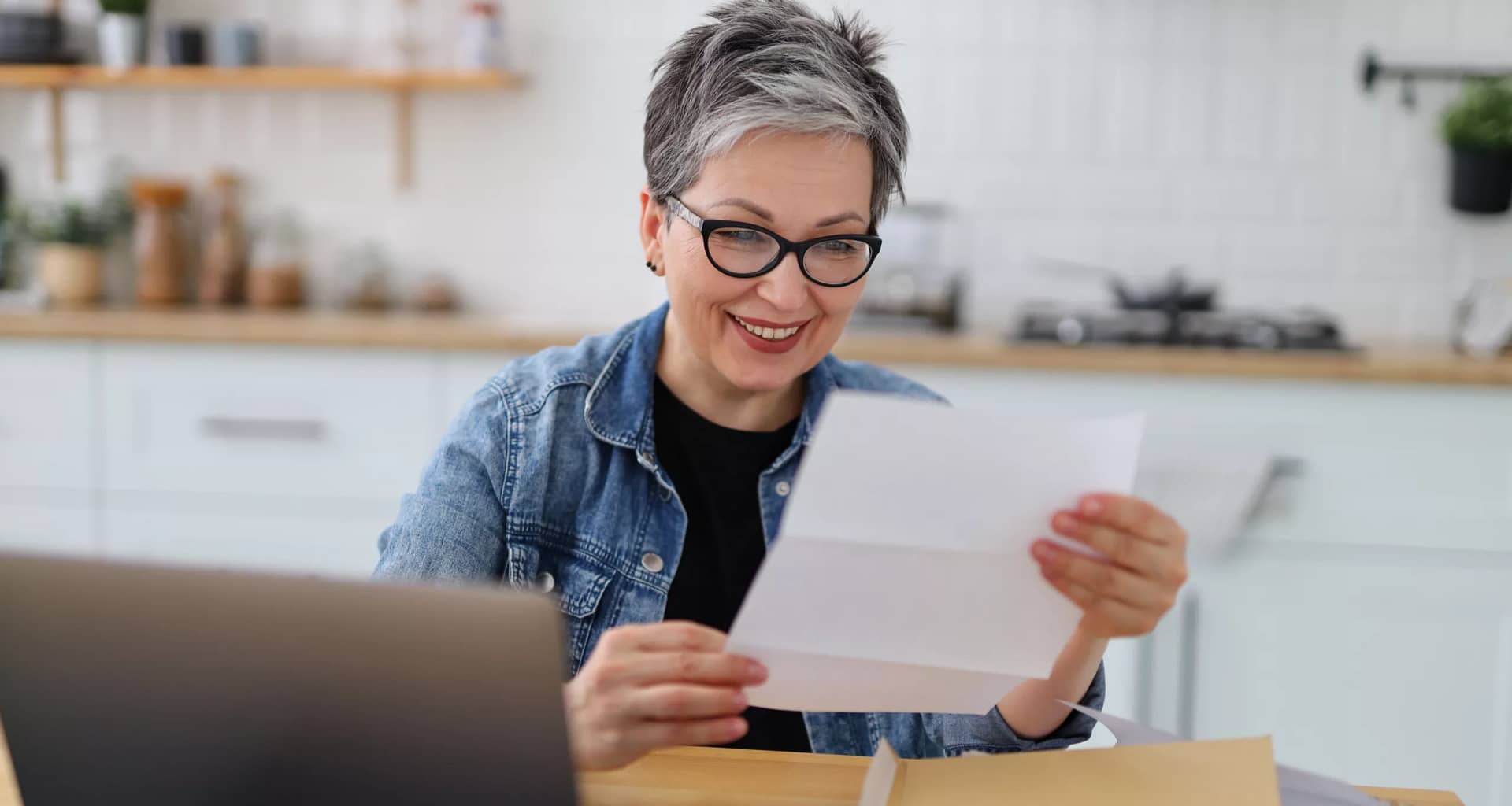 older woman document laptop gettyimages .jpg