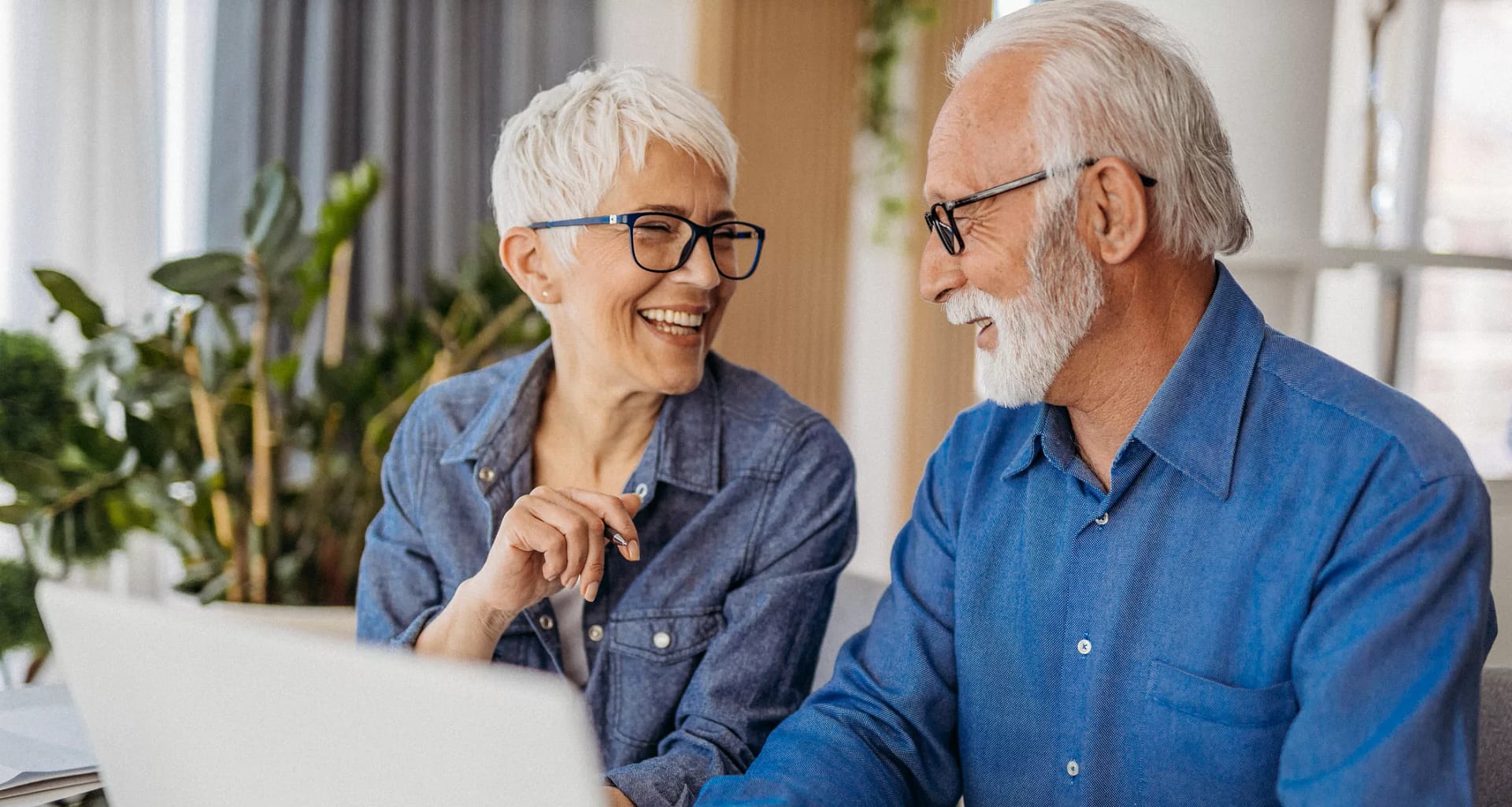 senior couple at laptop smiling gettyimages .jpg