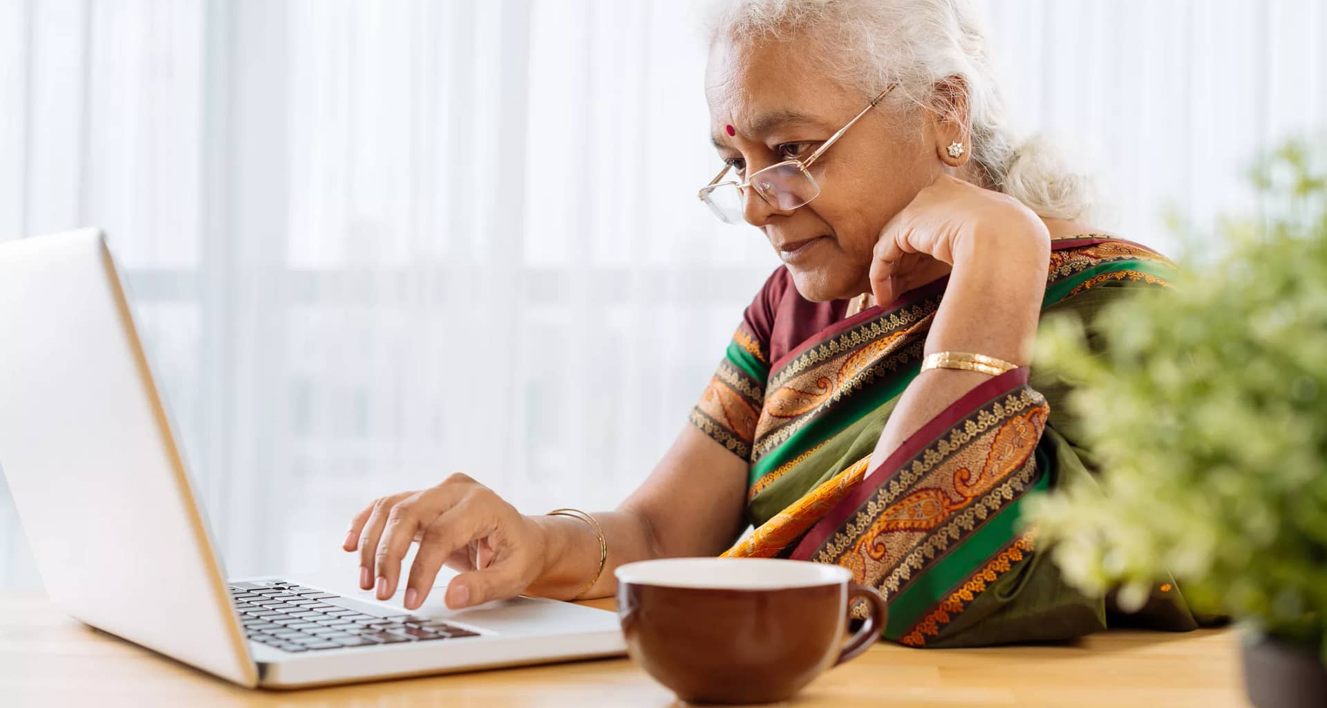 serious senior staring at laptop.jpg