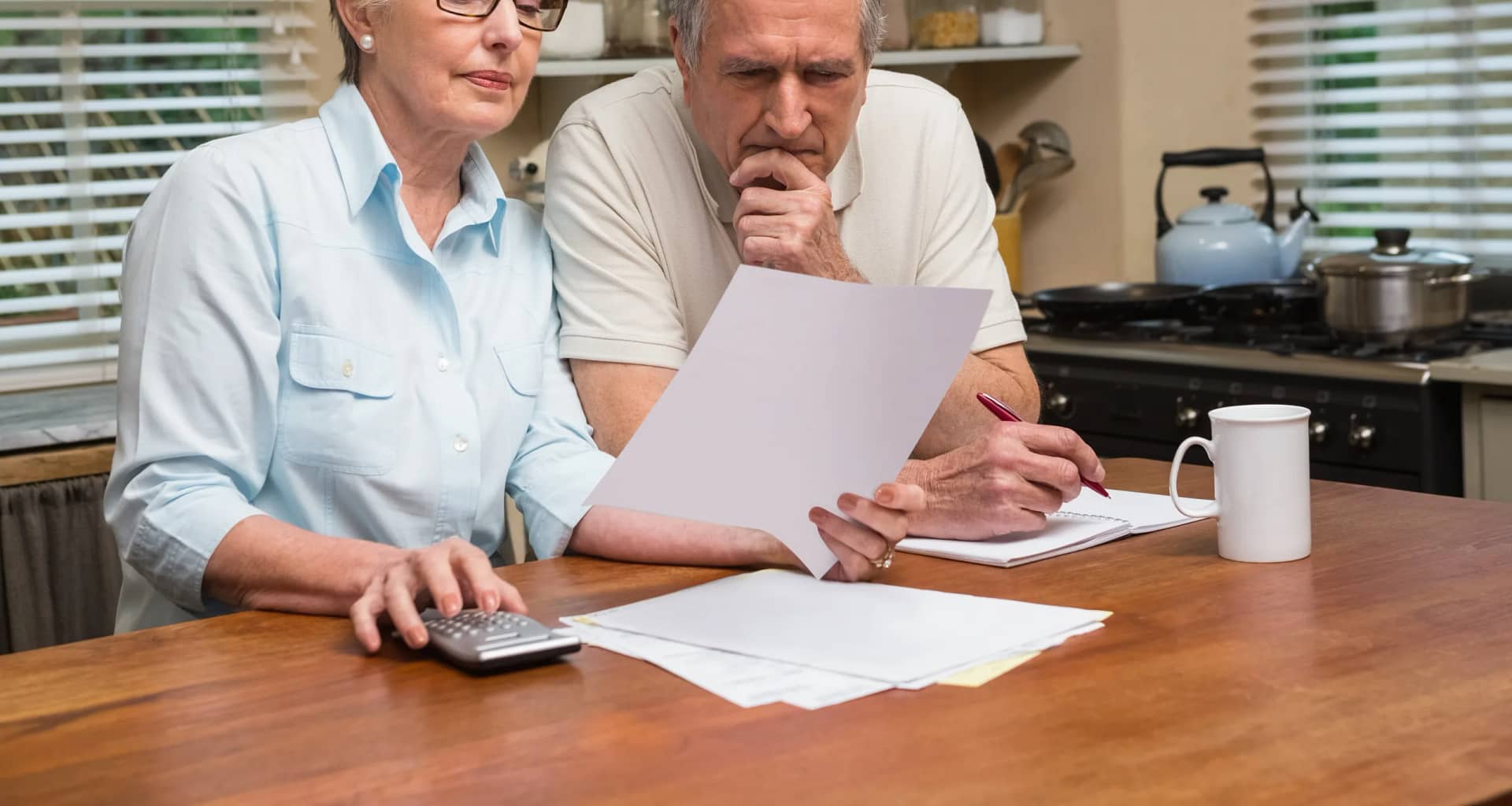 senior couple documents worried gettyimages .jpg