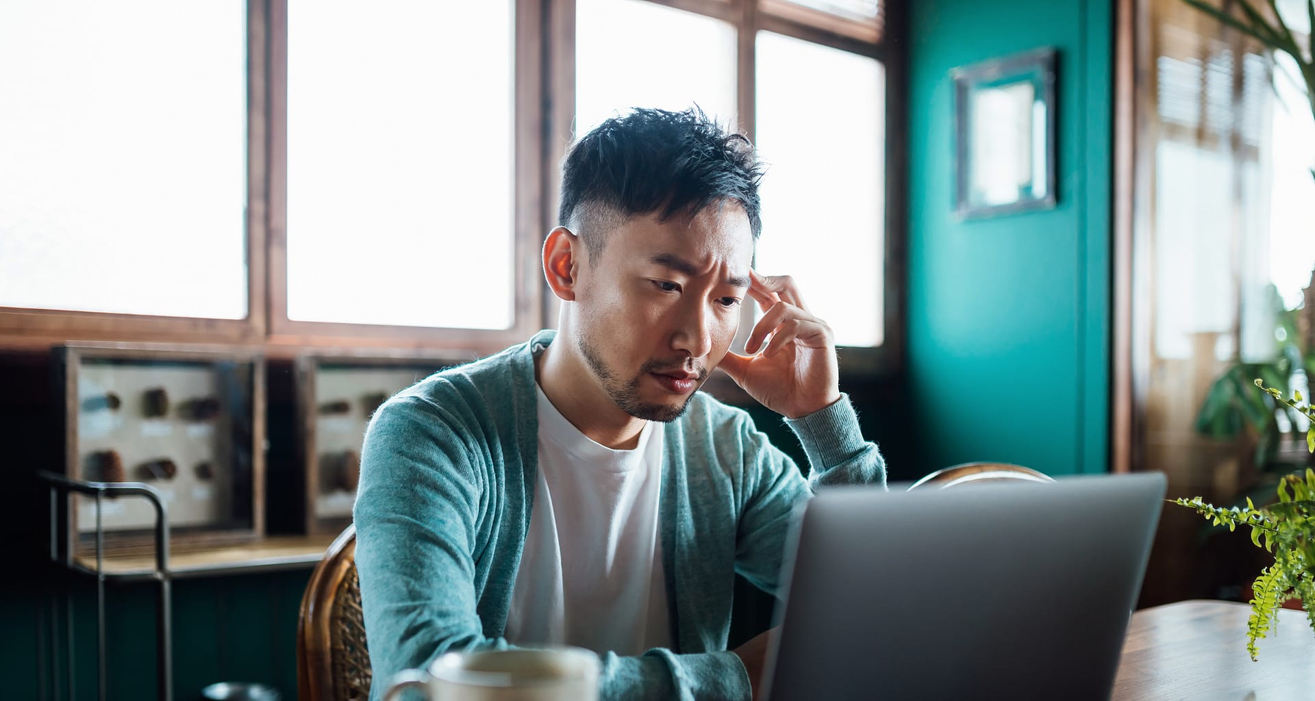 concerned unhappy person staring at laptop.jpg