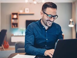 man s smiling laptop gettyimages .jpg