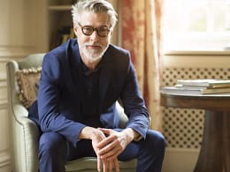 getty beard sitting serious expression blue shirt.jpg