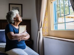 mourning loved one holding picture frame.jpg