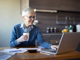 retired woman investing laptop k ira.jpg