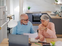 senior couple at a desk serious gettyimages .jpg