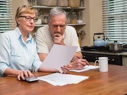 senior couple documents worried gettyimages .jpg