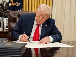 white house president donald trump signing executive order at resolute desk in oval office.jpg