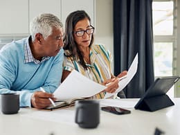 couple looking at documents together in kitchen.jpg