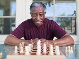 getty older man playing chess strategy moves winning.jpg