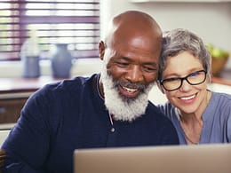 older couple at laptop smiling gettyimages .jpg