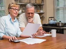 senior couple documents worried gettyimages .jpg