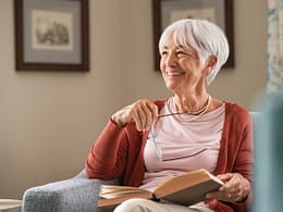 smiling person reading a book.jpg