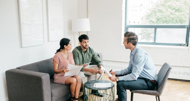 couple with realtor and paperwork KsVHLK.width .jpg
