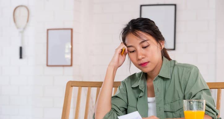 stressed woman with bills.width .jpg