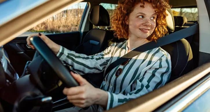 woman driving car fDYGYko.width .jpg