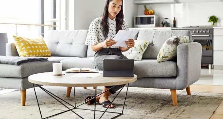 woman on couch with paperwork yVwyVDh.width .jpg