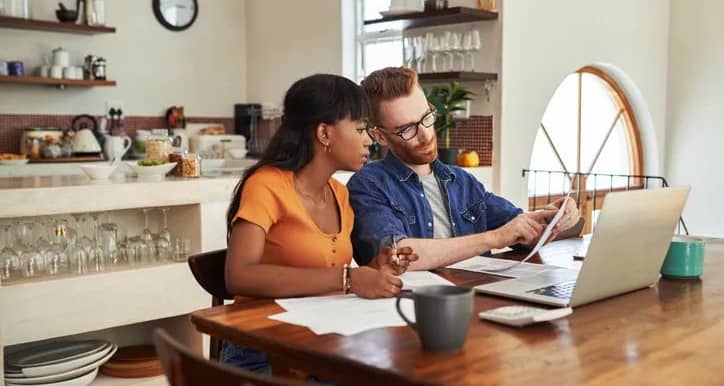 couple reviewing bills on laptop.width .jpg