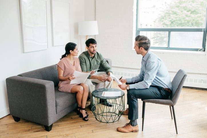 couple with realtor and paperwork KsVHLK.width .jpg