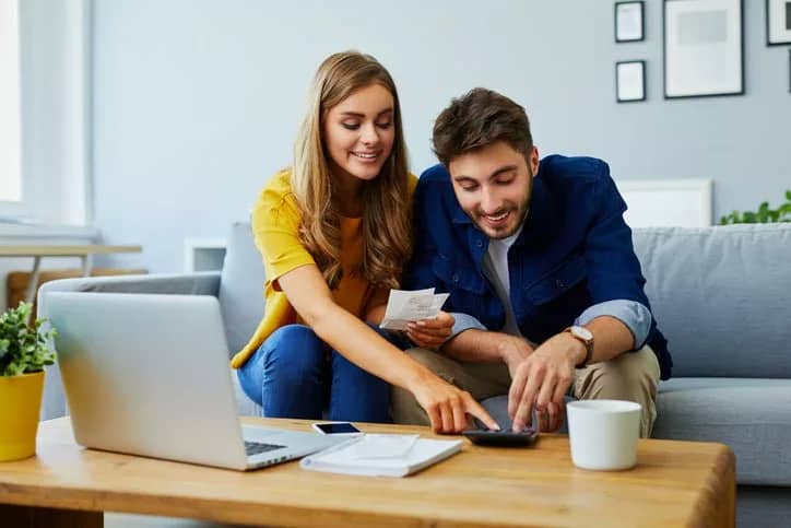 happy couple with calculator wpBfhu.width .jpg