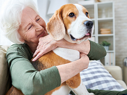 happy granny loving her dog in retirement