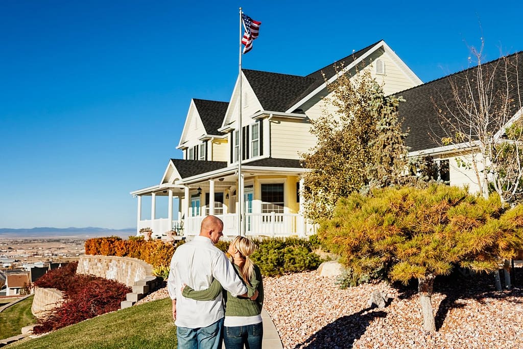 Couple standing outside admiring a large impr.width uPzLDk.jpg