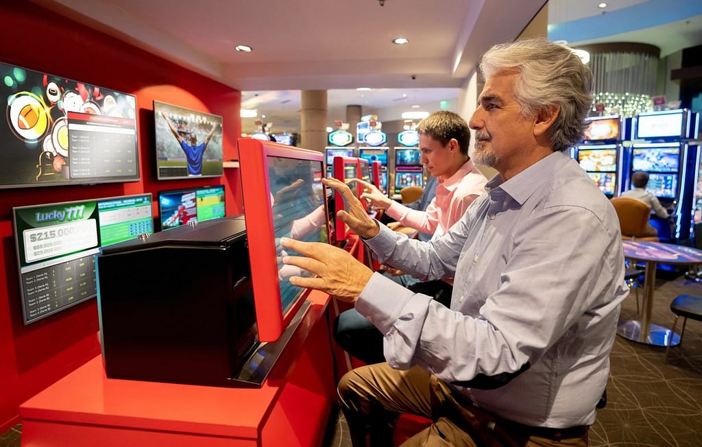 People partaking in sports gambling XSaswb.width