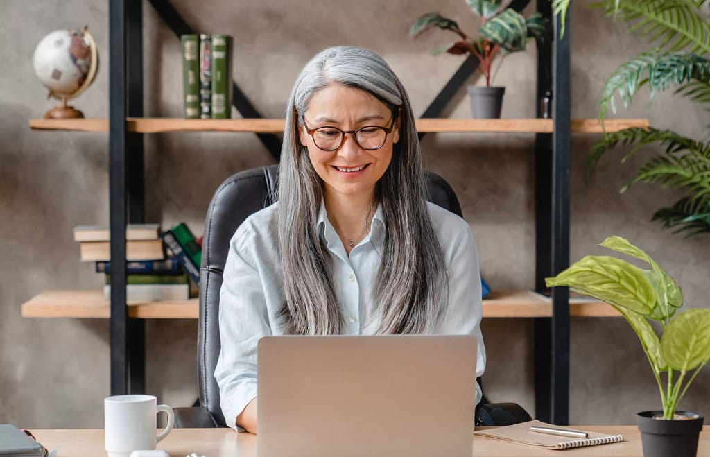 older woman laptop smiling gettyimages .jpg
