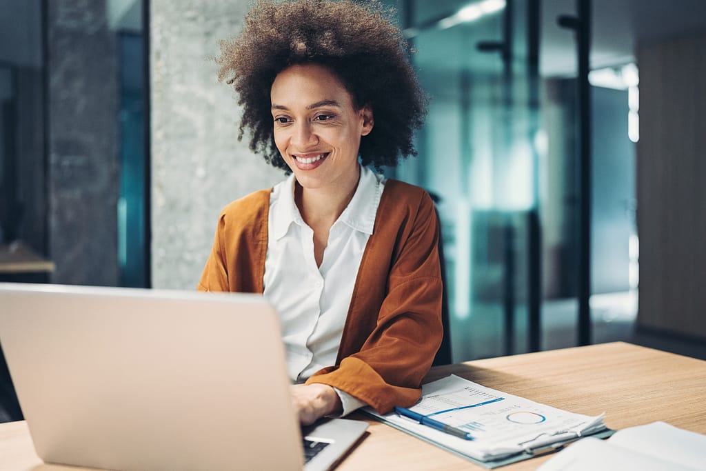 woman s smiling laptop gettyimages