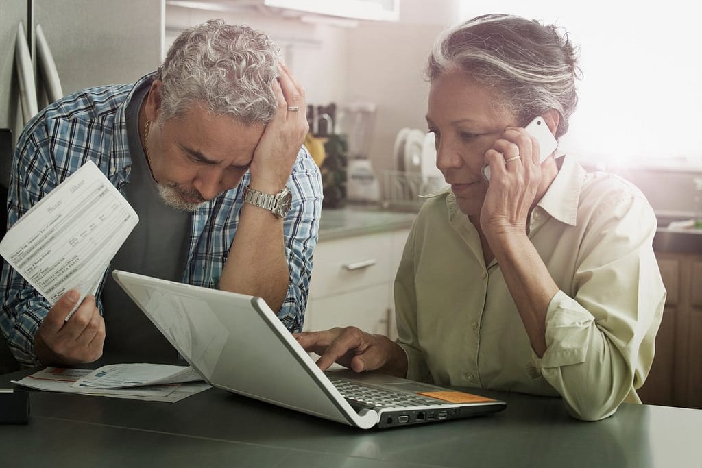 Worried looking mature couple with documents .width CCbZqgy.jpg